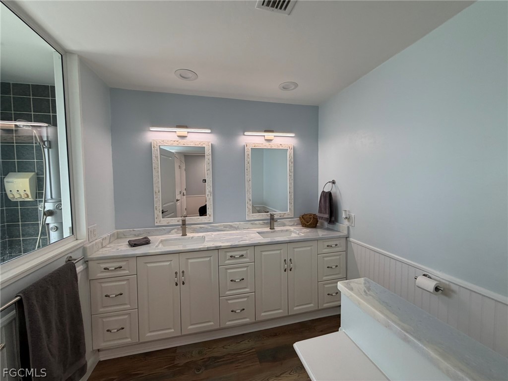 4743 Pine Island Road Matlacha, FL 33993 - Photo 20 of 34 a spacious bathroom with a double vanity sink mirror and