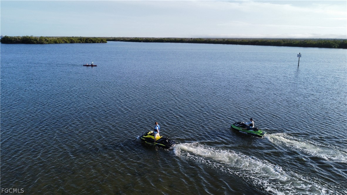 4743 Pine Island Road Matlacha, FL 33993 - Photo 27 of 34 a view of a lake with mountain