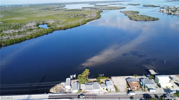 a front view of a house and a street sign