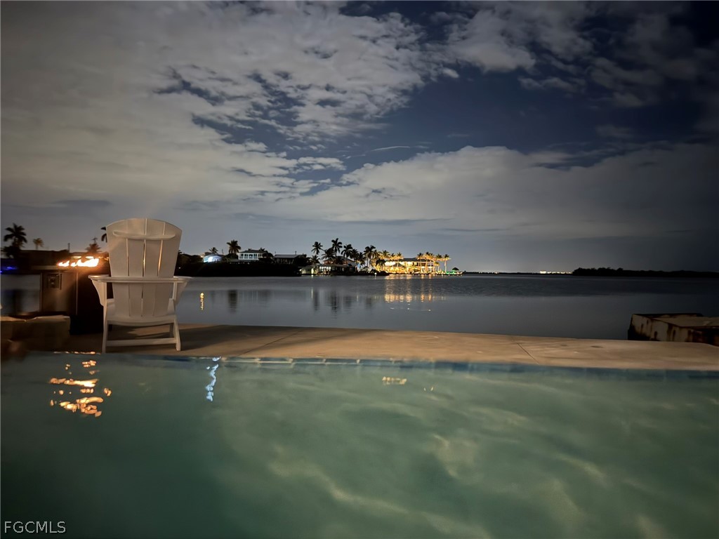 4743 Pine Island Road Matlacha, FL 33993 - Photo 7 of 34 a backyard of a house with lots of green space table and chairs