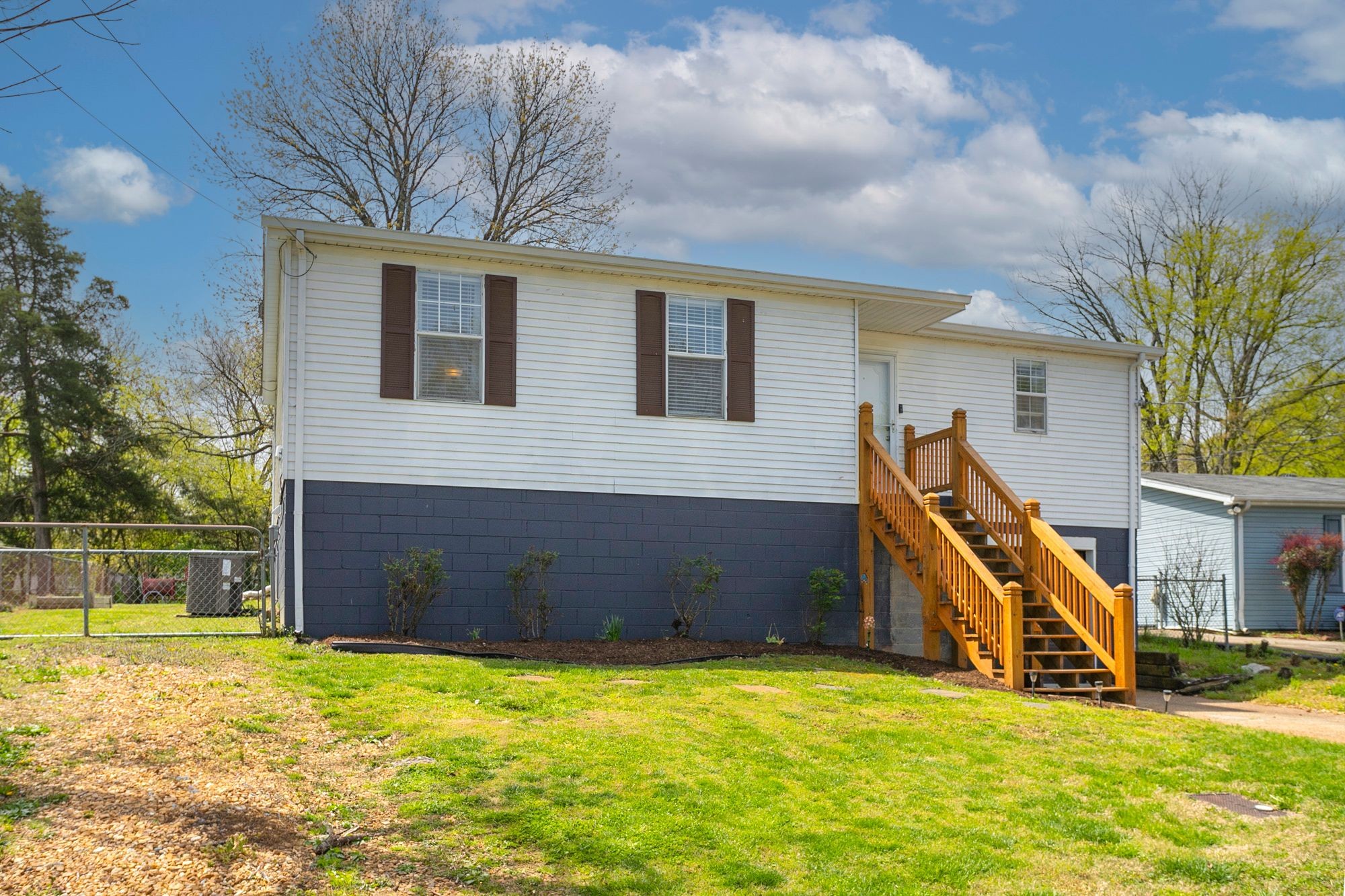 216 Warrior Road Madison, TN 37115 - Photo 3 of 37 a view of a house with a big yard and potted plants