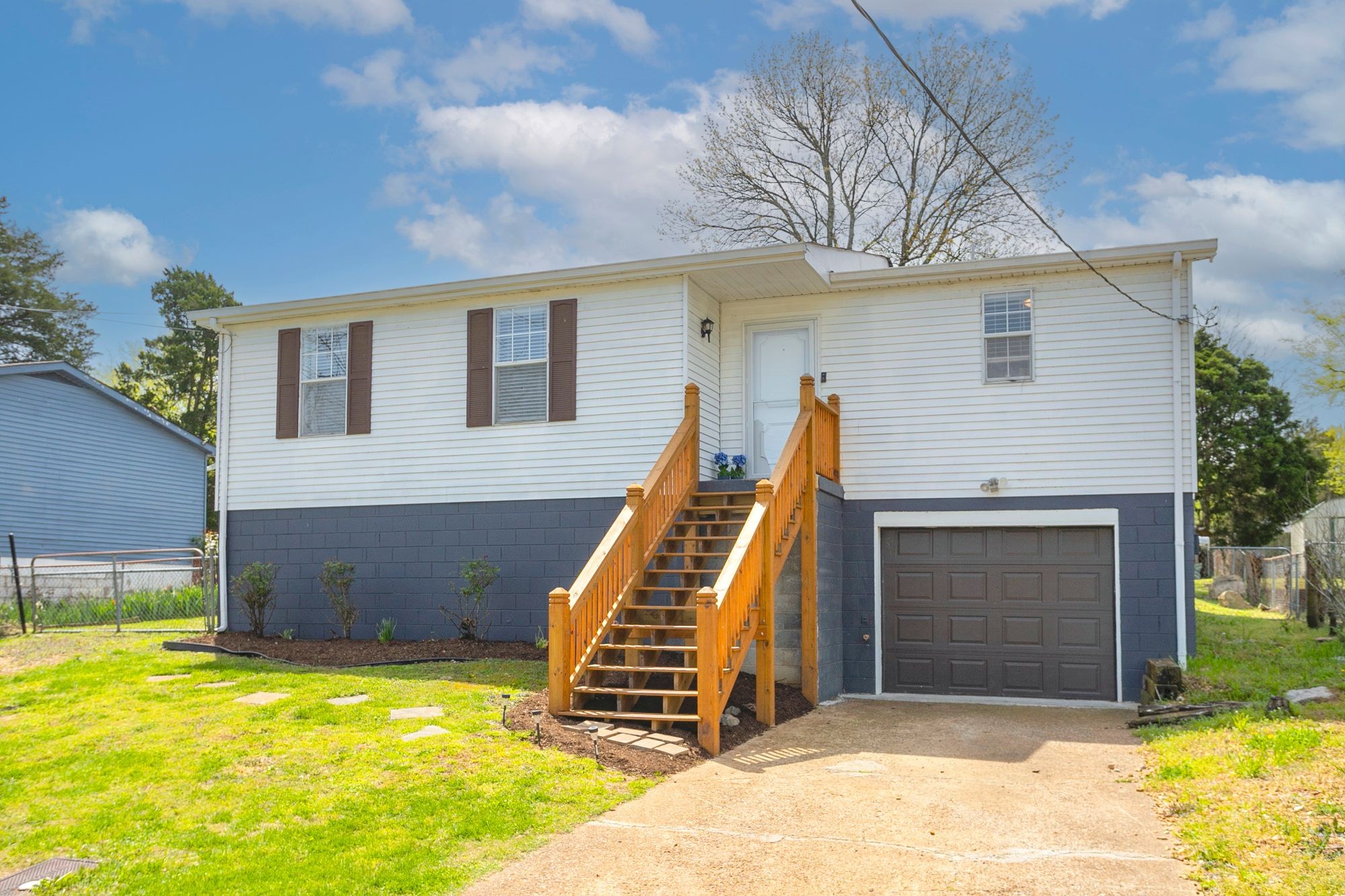 216 Warrior Road Madison, TN 37115 - Photo 5 of 37 a front view of a house with a garden