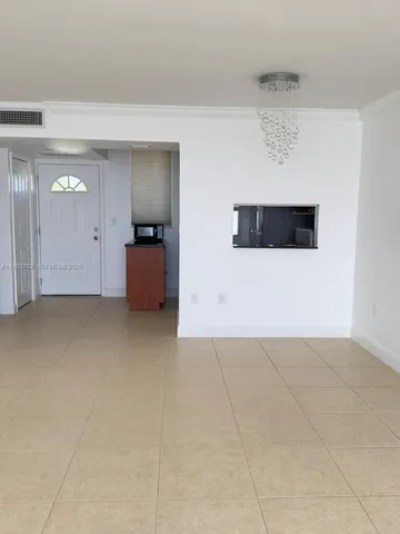 a kitchen with stainless steel appliances granite countertop a refrigerator a stove and a sink with wooden cabinets