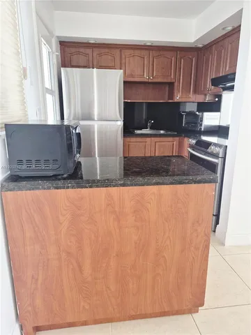 a view of storage and utility room with racks on the wall