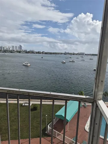 a view of balcony with wooden floor