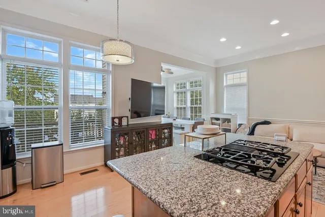 a living room with fireplace furniture and a flat screen tv