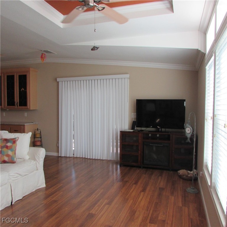3083 Sloop Lane St. James City, FL 33956 - Photo 11 of 41 a living room with furniture and a flat screen tv
