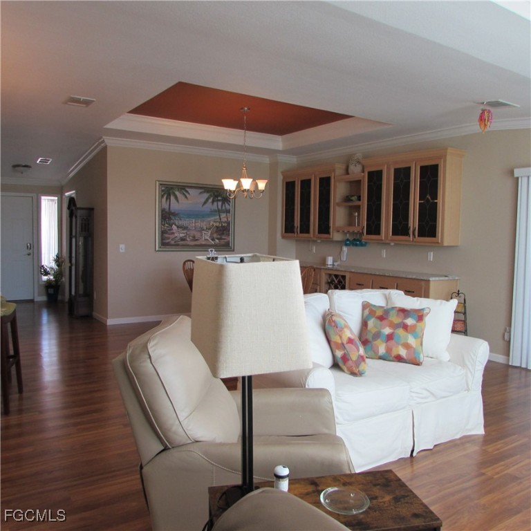 3083 Sloop Lane St. James City, FL 33956 - Photo 12 of 41 a living room with furniture and painting on the wall