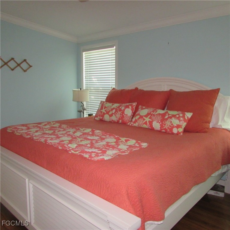 3083 Sloop Lane St. James City, FL 33956 - Photo 20 of 41 a bedroom with a bed and window