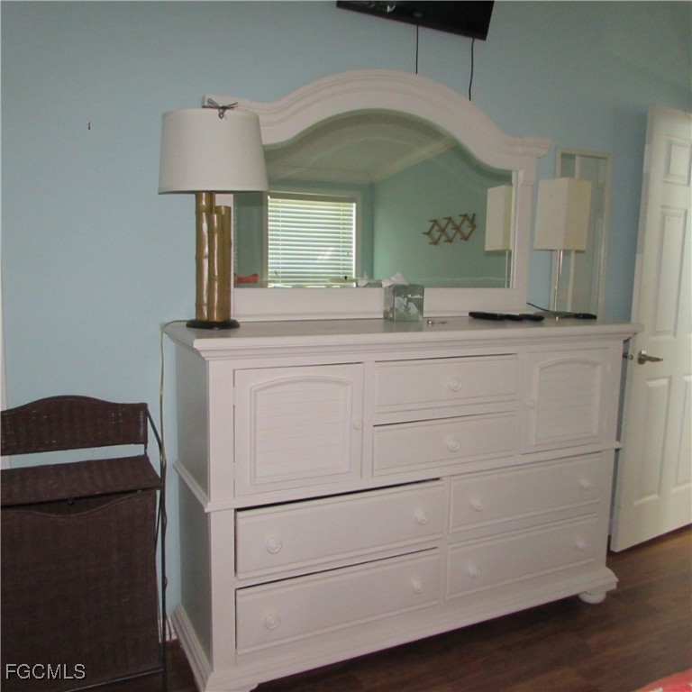 3083 Sloop Lane St. James City, FL 33956 - Photo 21 of 41 a bathroom with a sink and a mirror