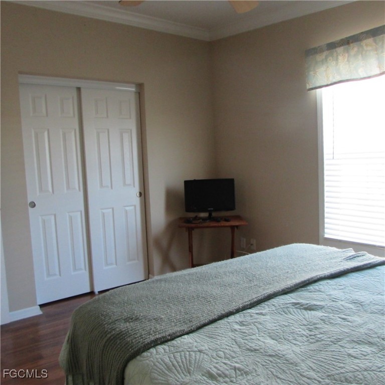 3083 Sloop Lane St. James City, FL 33956 - Photo 25 of 41 a bedroom with a bed and a television