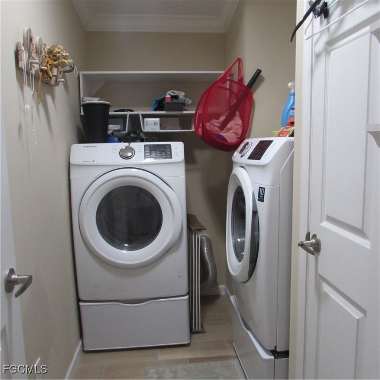 3083 Sloop Lane St. James City, FL 33956 - Photo 27 of 41 a utility room with dryer and washer