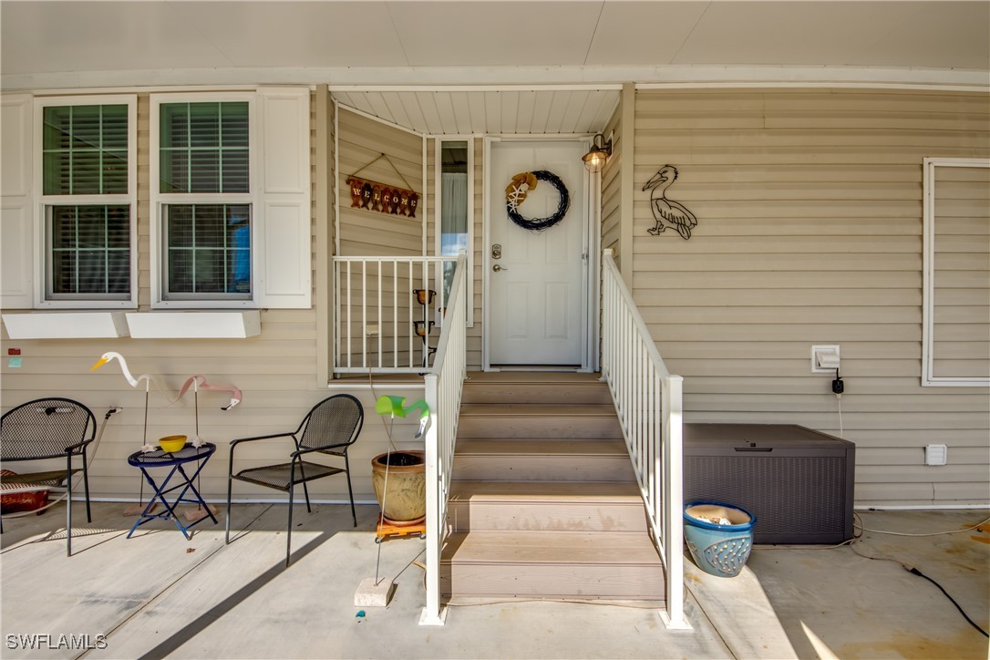 3083 Sloop Lane St. James City, FL 33956 - Photo 5 of 41 a view of entryway and hall with seating space