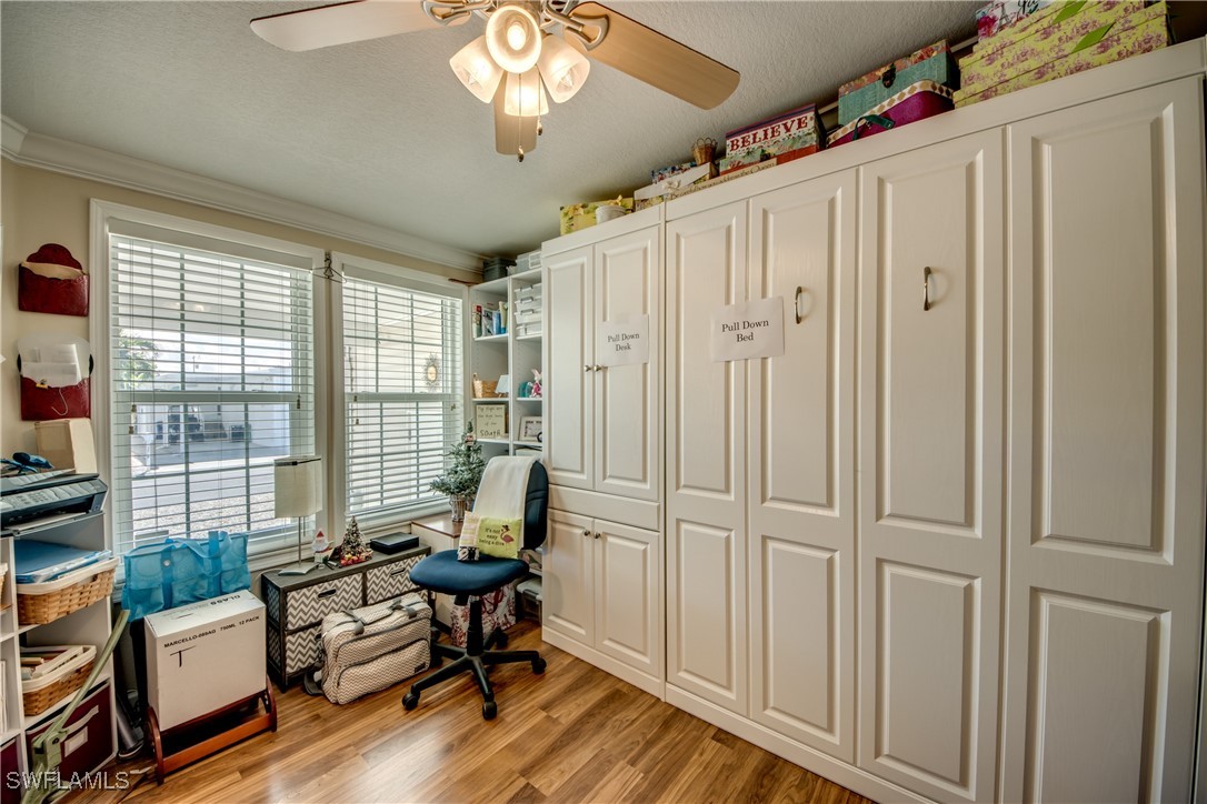 3083 Sloop Lane St. James City, FL 33956 - Photo 6 of 41 a view of a livingroom with workspace and a window