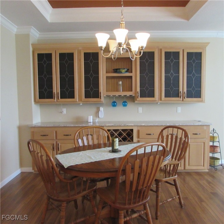 3083 Sloop Lane St. James City, FL 33956 - Photo 8 of 41 a view of a dining room with furniture and chandelier