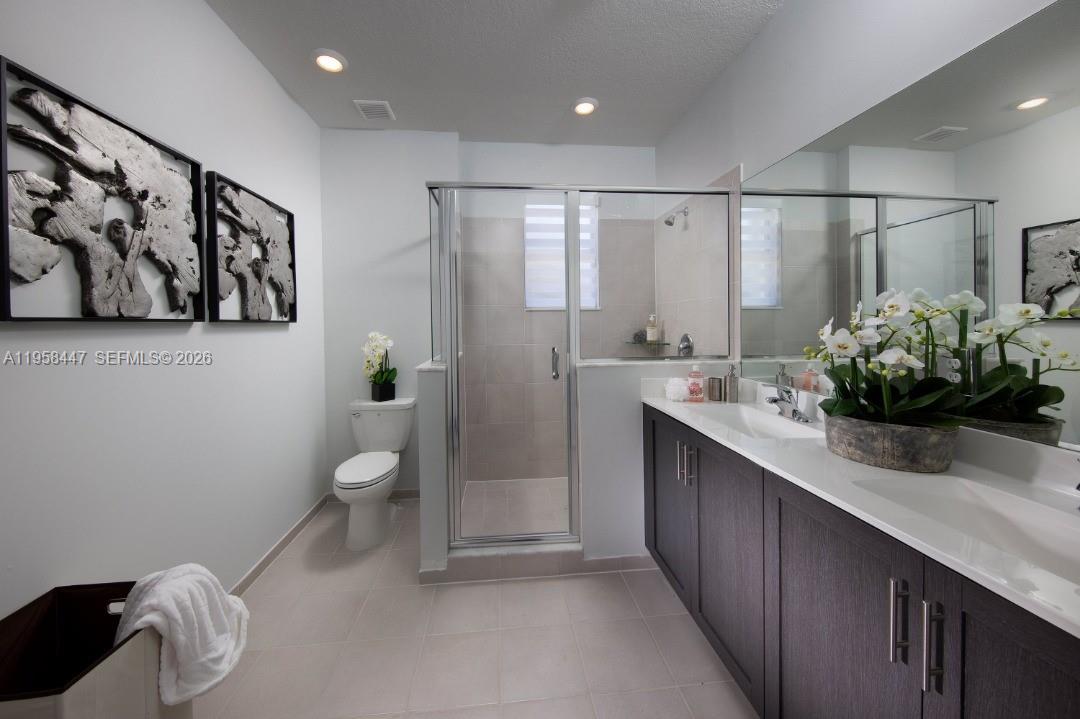 1070 Southeast 26th Street Homestead, FL 33035 - Photo 21 of 21 a bathroom with a granite countertop sink a toilet and shower