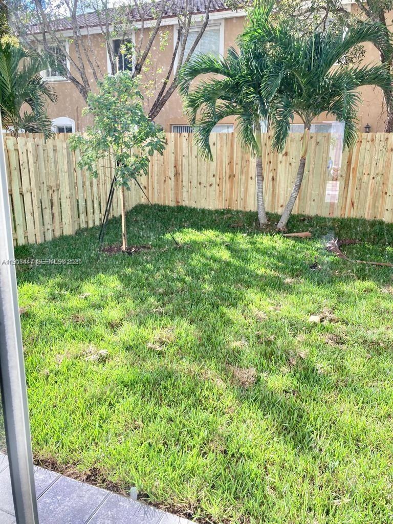 1070 Southeast 26th Street Homestead, FL 33035 - Photo 9 of 21 a view of a backyard with a garden