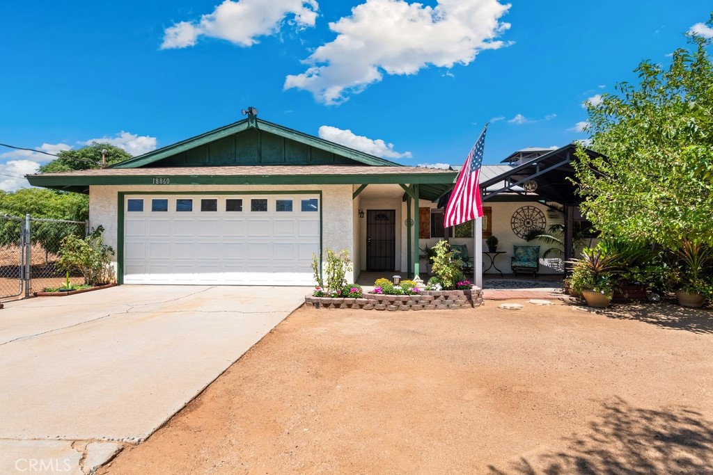 18860 Dallas Avenue Riverside, CA 92508 - Photo 1 of 1 a front view of a house with a yard and garage