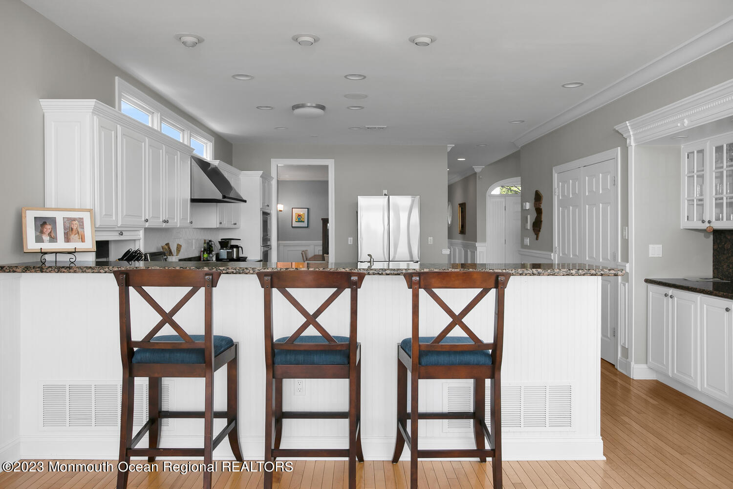 146 Conover Lane Red Bank, NJ 07701 - Photo 14 of 44 a kitchen with a table chairs refrigerator and cabinets