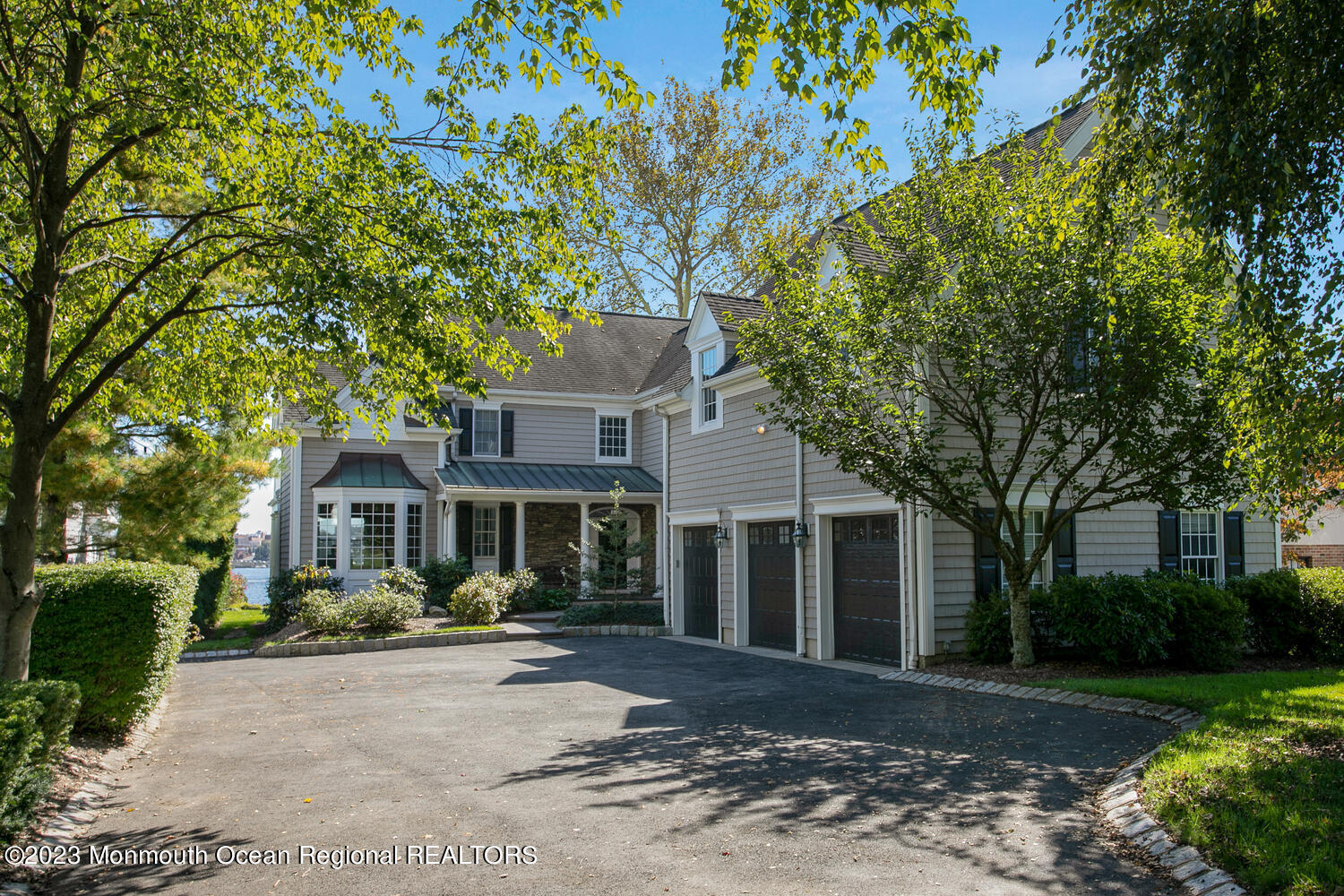 146 Conover Lane Red Bank, NJ 07701 - Photo 2 of 44 a front view of a house with a yard and potted plants