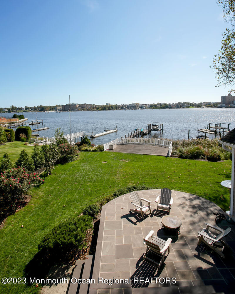 146 Conover Lane Red Bank, NJ 07701 - Photo 24 of 44 a view of a lake with couches and lake view