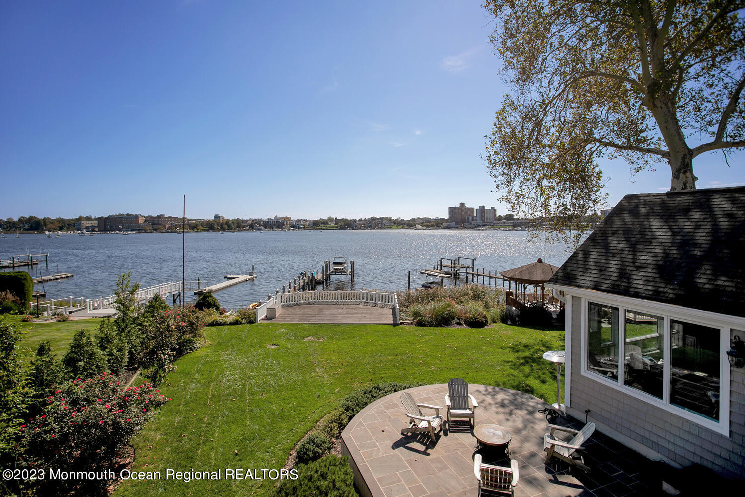 146 Conover Lane Red Bank, NJ 07701 - Photo 25 of 44 a view of a lake with couches and city view