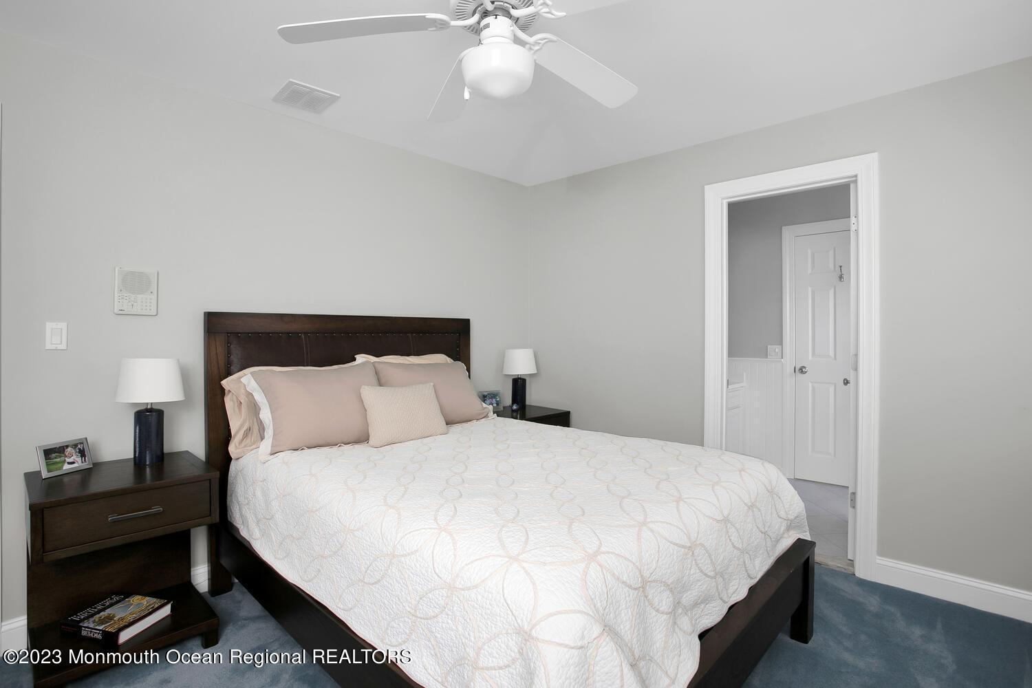 146 Conover Lane Red Bank, NJ 07701 - Photo 27 of 44 a bedroom with a bed and a chandelier