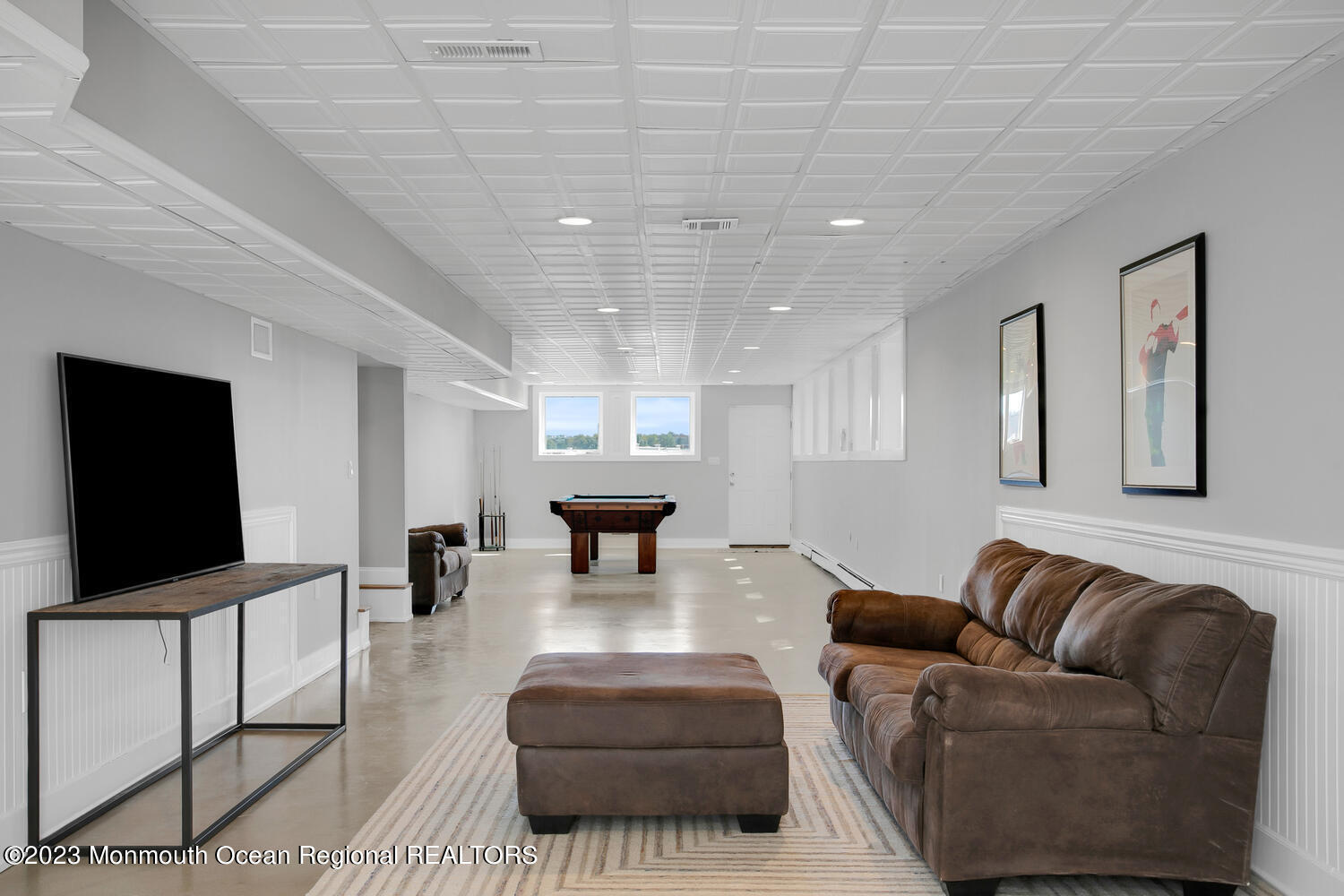 146 Conover Lane Red Bank, NJ 07701 - Photo 32 of 44 a living room with furniture and a flat screen tv