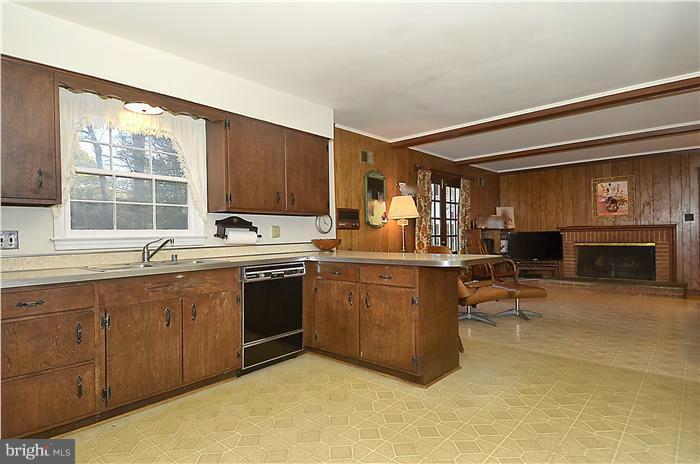 7700 Groton Road Bethesda, MD 20817 - Photo 11 of 30 a kitchen with a sink cabinets and window