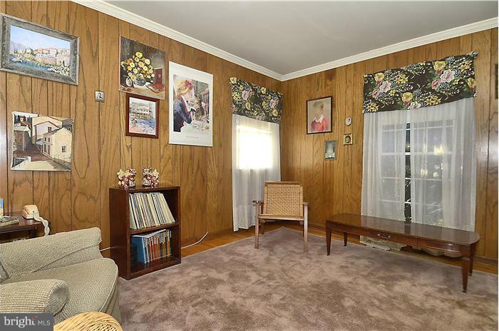7700 Groton Road Bethesda, MD 20817 - Photo 15 of 30 a living room with furniture and a painting on the wall