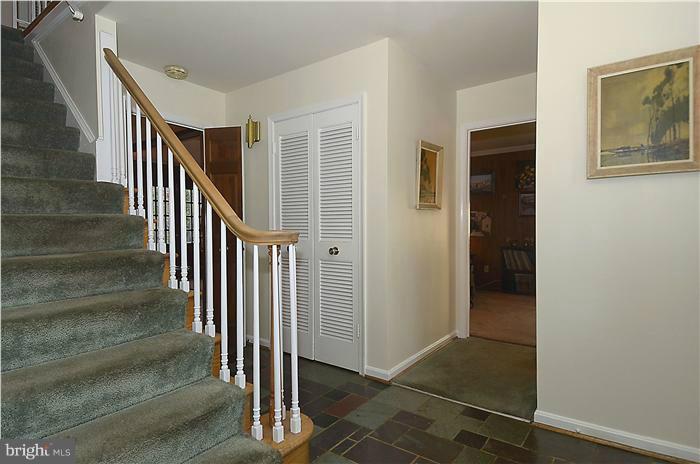 7700 Groton Road Bethesda, MD 20817 - Photo 16 of 30 a view of entryway with wooden floor and stairs