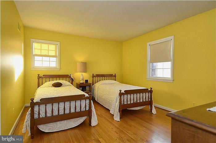 7700 Groton Road Bethesda, MD 20817 - Photo 19 of 30 a bedroom with two beds and a window