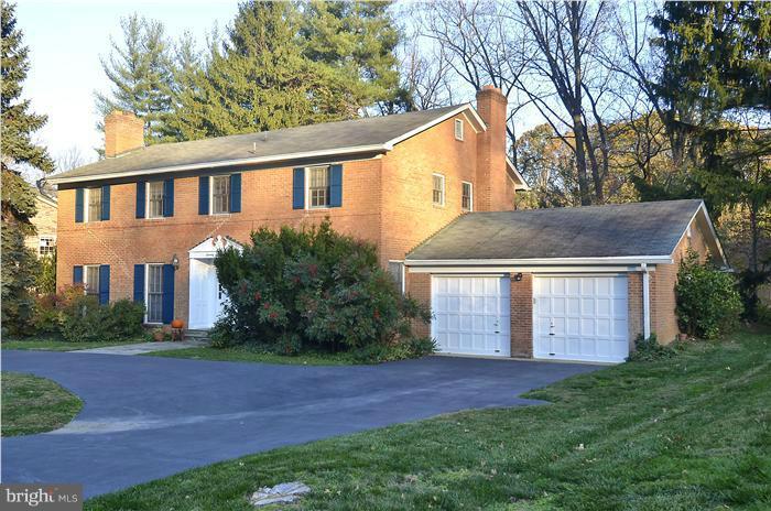 7700 Groton Road Bethesda, MD 20817 - Photo 24 of 30 a front view of a house with a garden