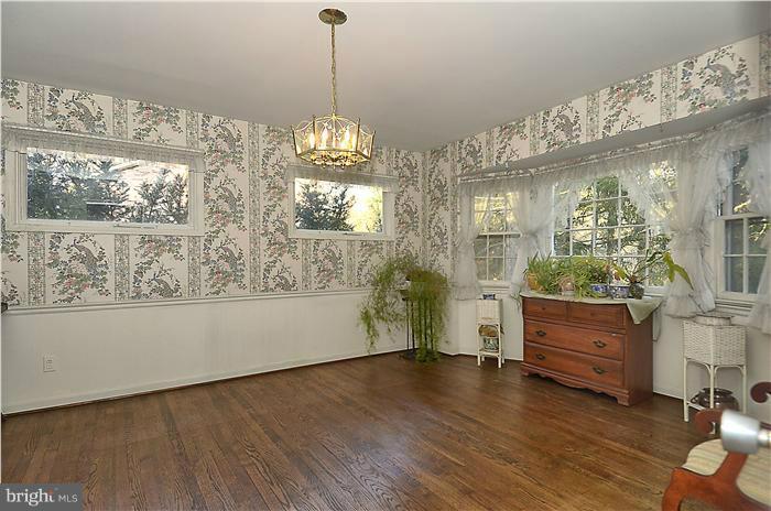7700 Groton Road Bethesda, MD 20817 - Photo 5 of 30 a view of a room with wooden floor and windows