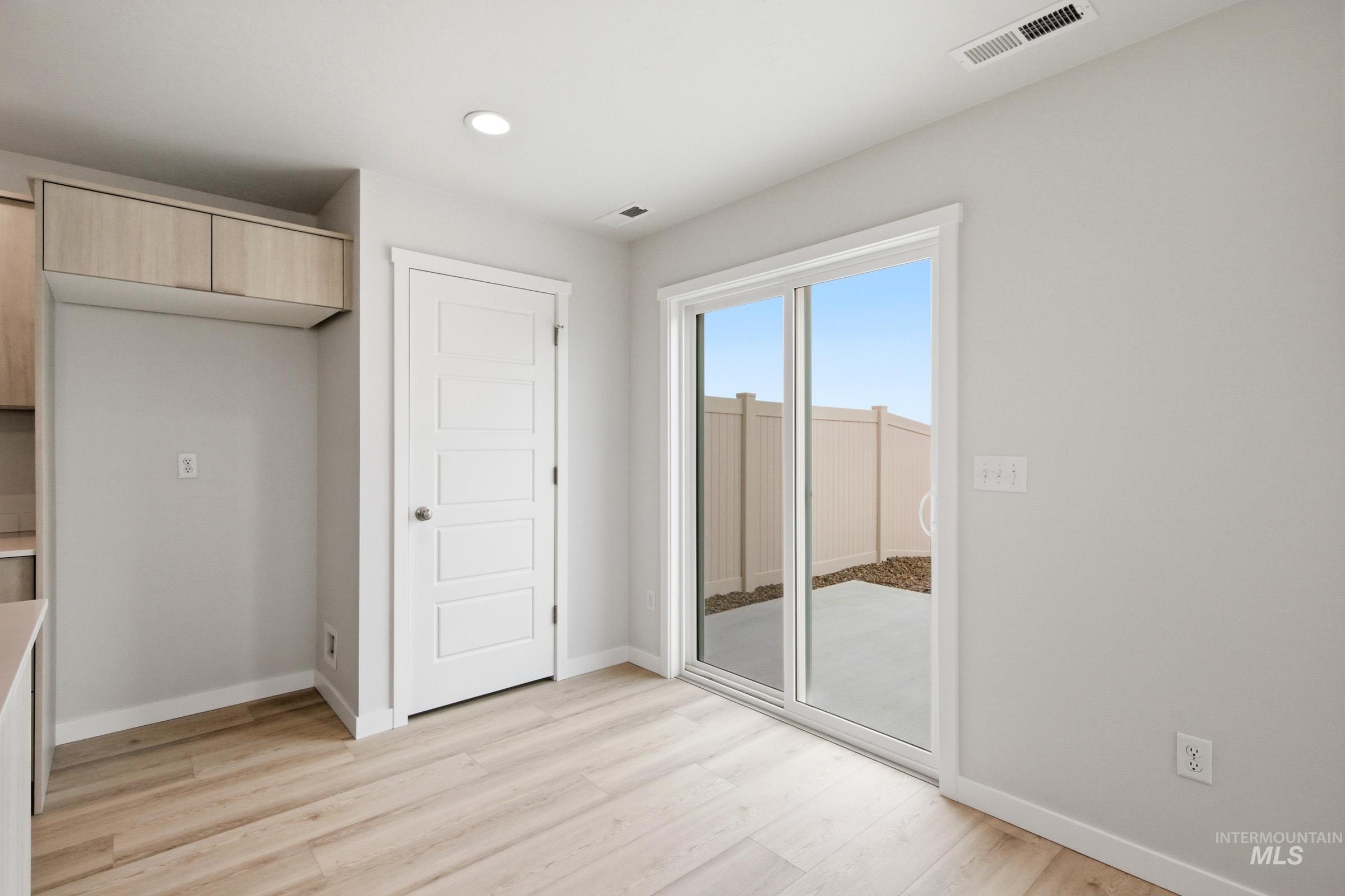 10770 Rutland Street Caldwell, ID 83605 - Photo 12 of 22 Light wood-finish flooring complements the neutral wall tones
