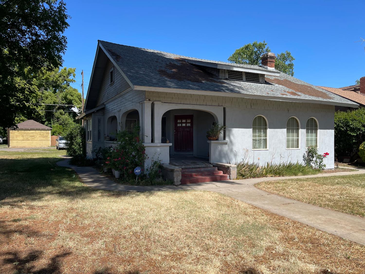 425 North D Street Madera, CA 93638 - Photo 2 of 3 a front view of a house with a yard