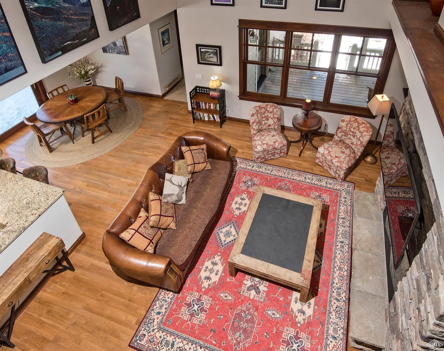 83 Newquist Street Eagle, CO 81631 - Photo 13 of 25 a living room with furniture and a fireplace