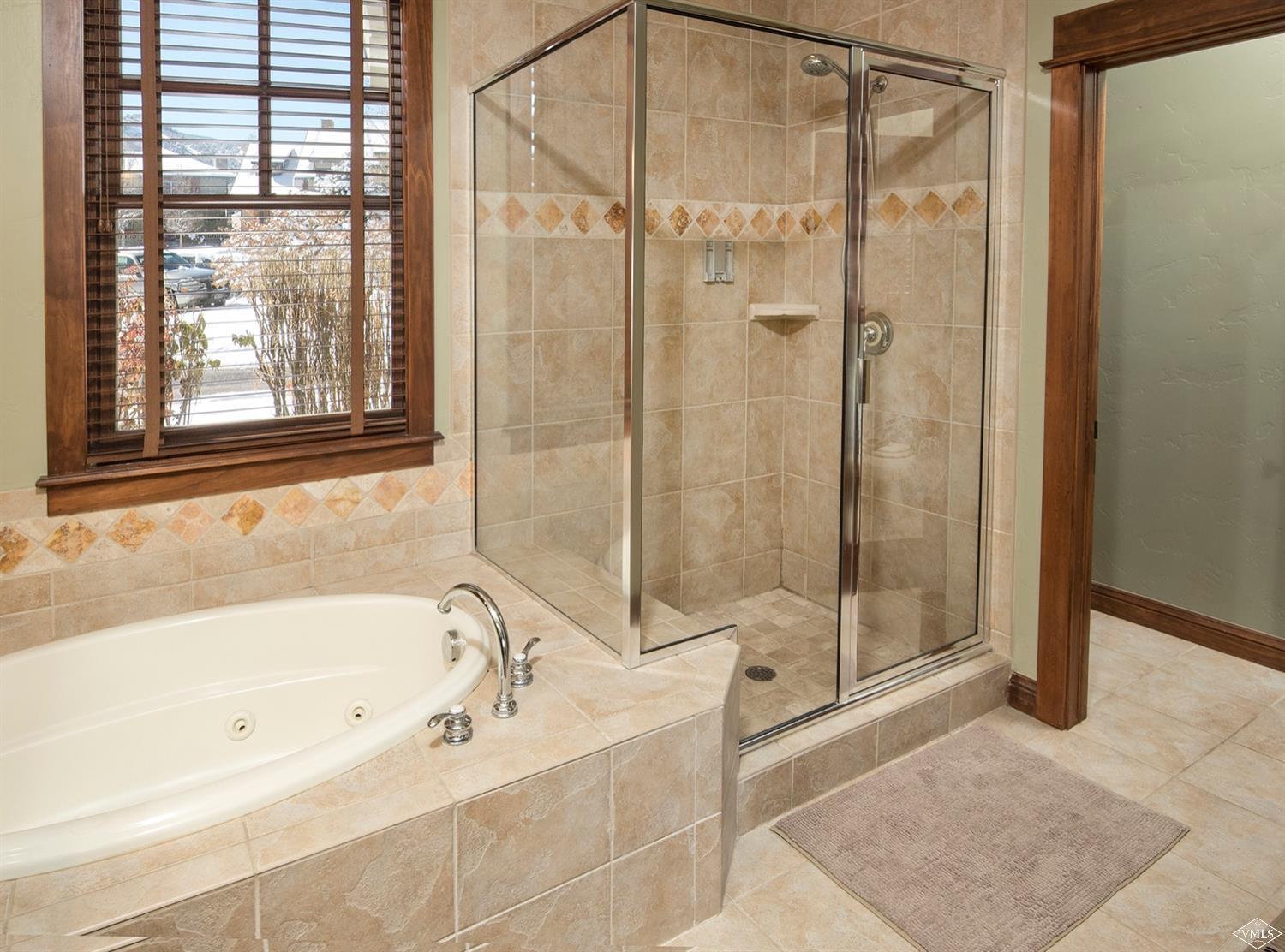 83 Newquist Street Eagle, CO 81631 - Photo 16 of 25 a bathroom with a bathtub and shower