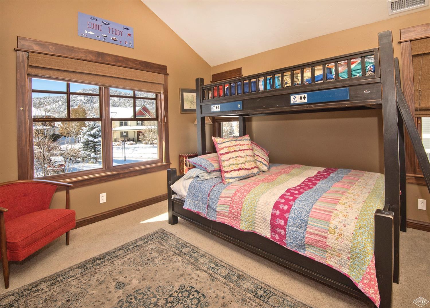 83 Newquist Street Eagle, CO 81631 - Photo 18 of 25 a bedroom with a bed and a window with outer view