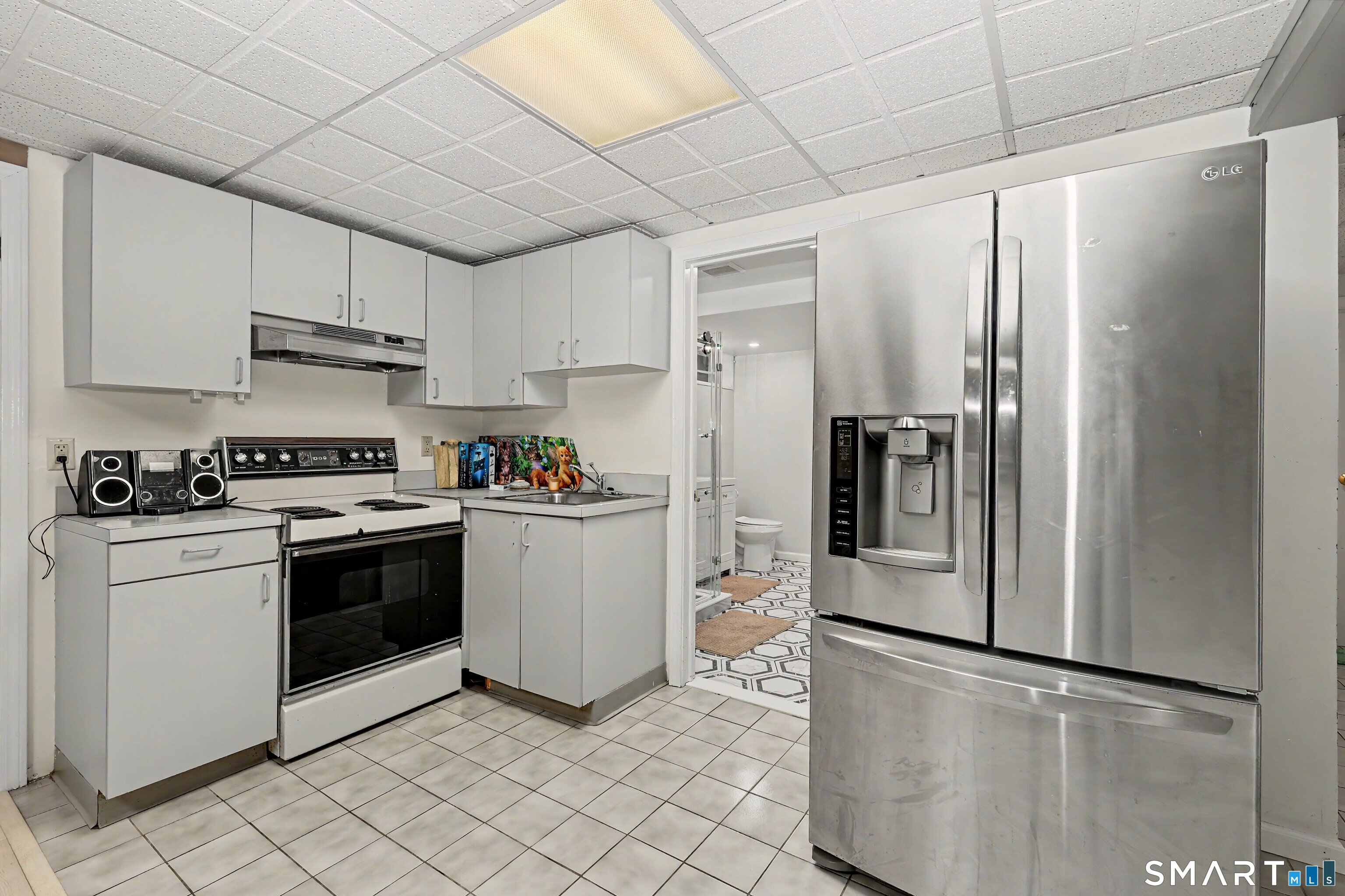 44 Haverhill Road Trumbull, CT 06611 - Photo 27 of 32 a kitchen with stainless steel appliances a refrigerator sink and cabinets