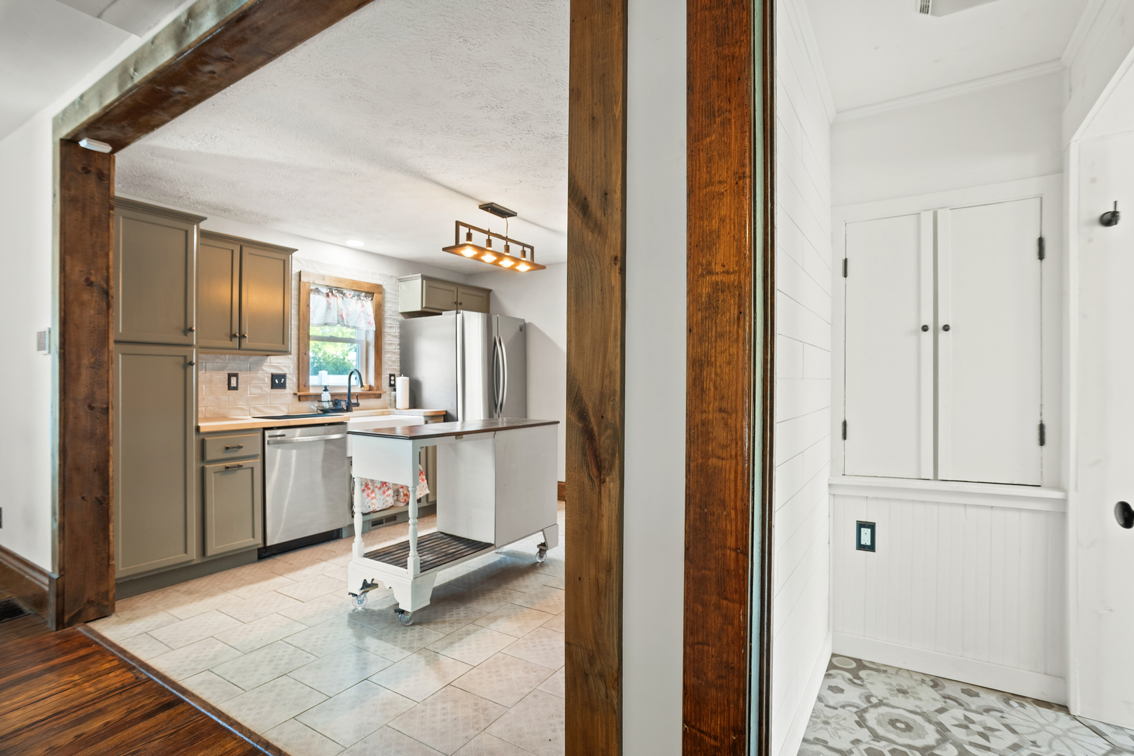 702 North Walnut Street Normal, IL 61761 - Photo 12 of 45 a kitchen with a refrigerator and white cabinets