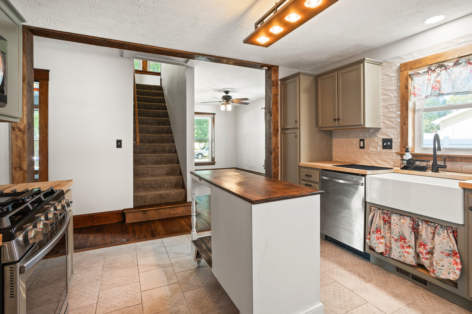 702 North Walnut Street Normal, IL 61761 - Photo 13 of 45 a kitchen with stainless steel appliances a sink stove and cabinets