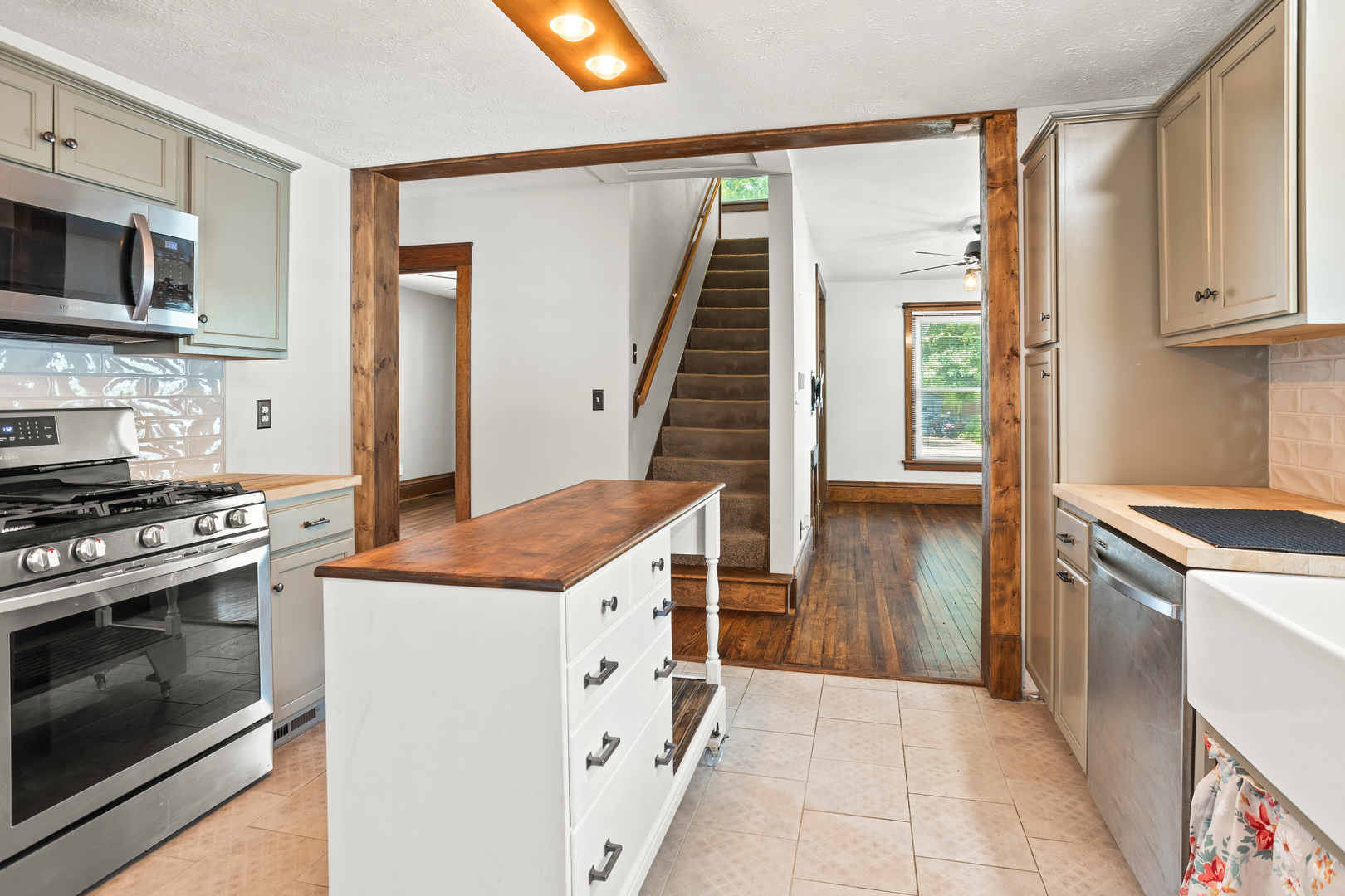 702 North Walnut Street Normal, IL 61761 - Photo 14 of 45 a kitchen with stainless steel appliances granite countertop a stove and a sink