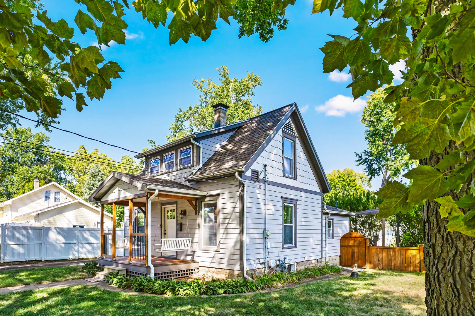 702 North Walnut Street Normal, IL 61761 - Photo 2 of 45 a front view of a house with garden