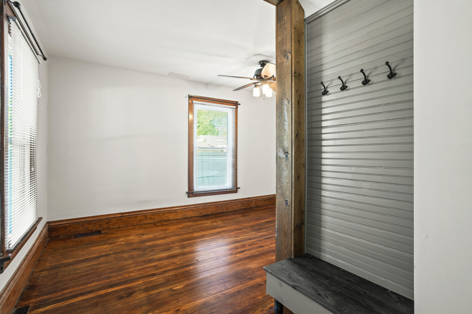 702 North Walnut Street Normal, IL 61761 - Photo 21 of 45 a view of a hallway with wooden floor and a bathroom