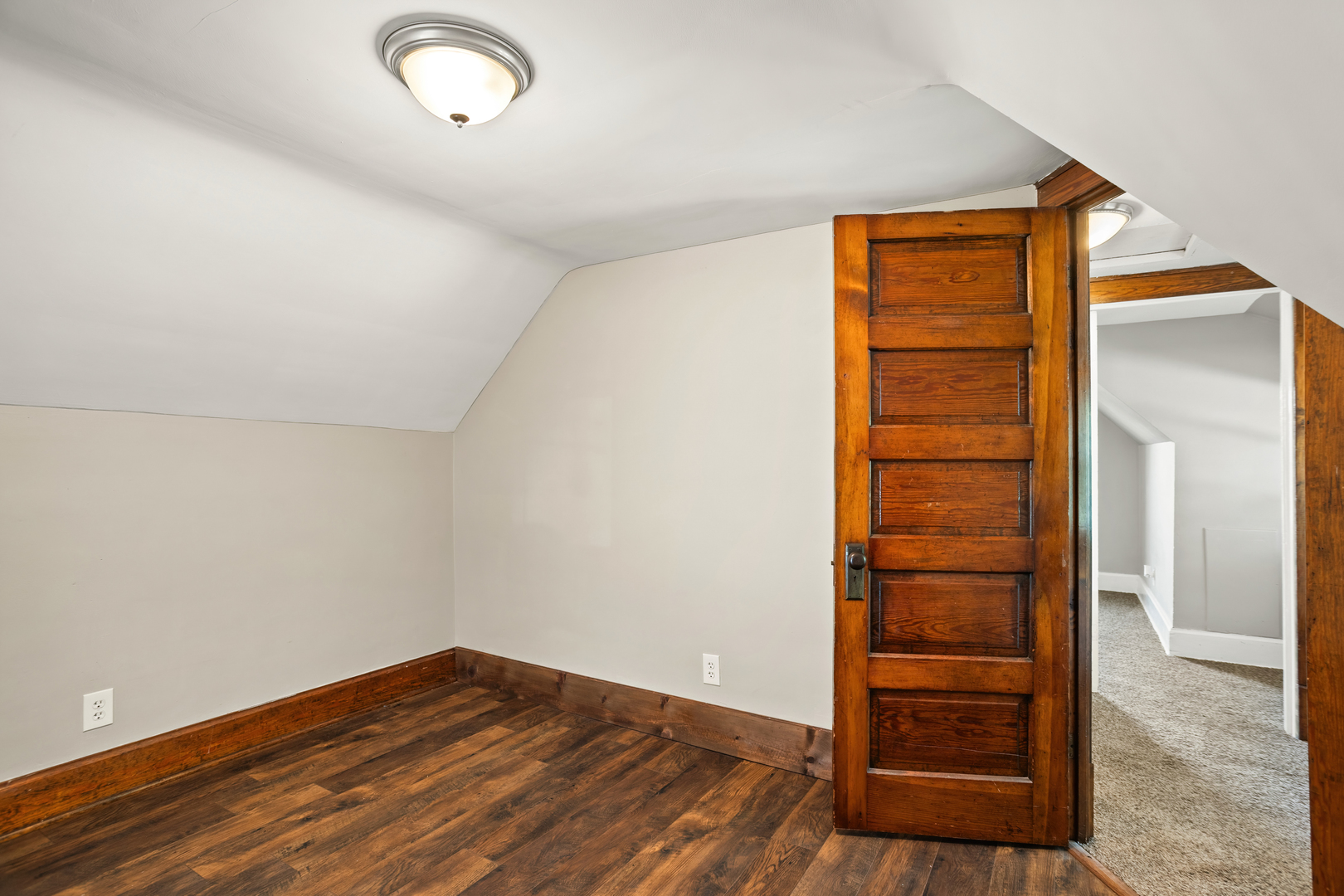 702 North Walnut Street Normal, IL 61761 - Photo 23 of 45 an empty room with wooden floor and closet