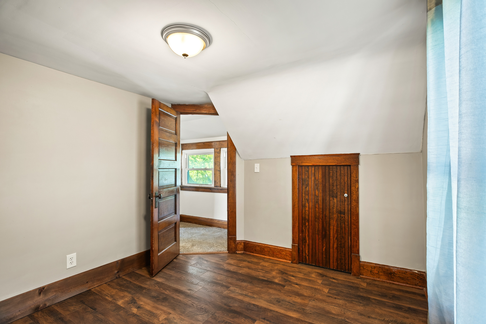702 North Walnut Street Normal, IL 61761 - Photo 24 of 45 an empty room with wooden floor closet and windows