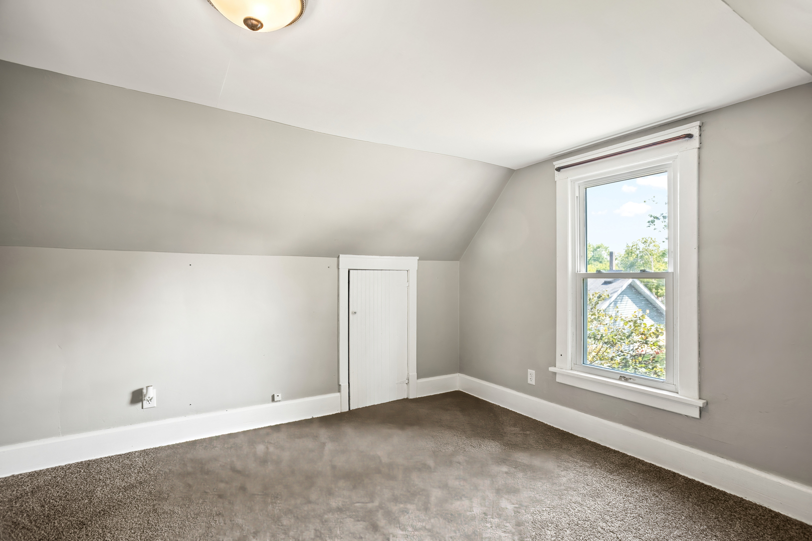 702 North Walnut Street Normal, IL 61761 - Photo 28 of 45 an empty room with windows