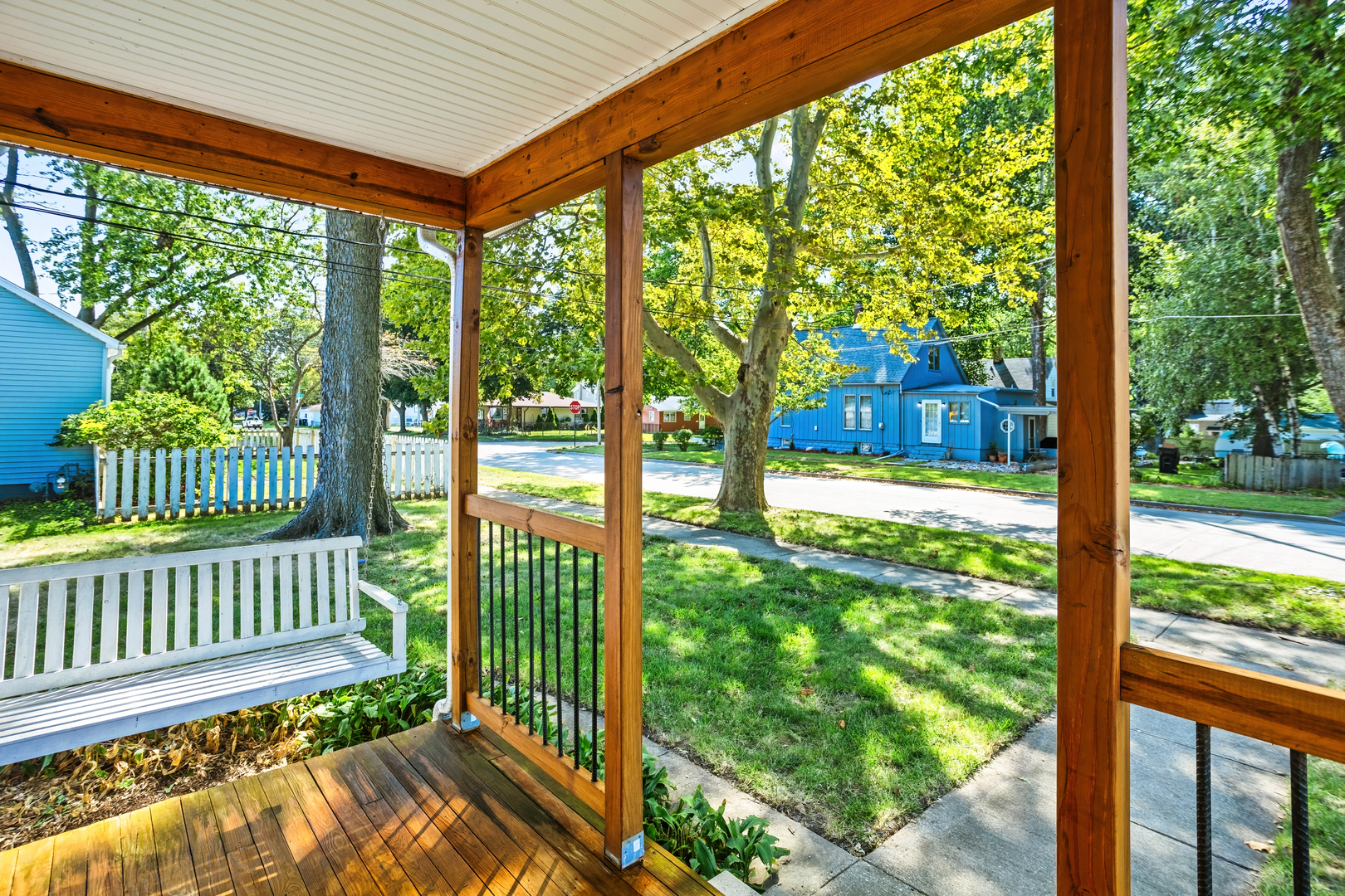 702 North Walnut Street Normal, IL 61761 - Photo 3 of 45 a view of a porch and a yard with table and chairs