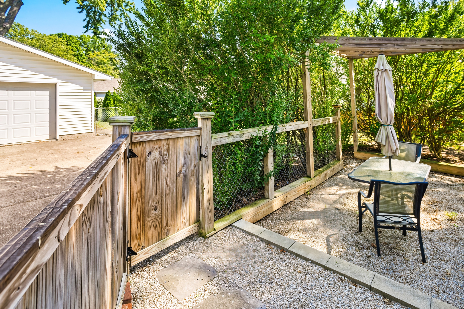 702 North Walnut Street Normal, IL 61761 - Photo 32 of 45 a view of balcony with wooden floor and outdoor seating
